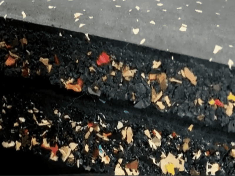 A cross-section diagram showing the process of injecting adhesive into a rubber floor void
